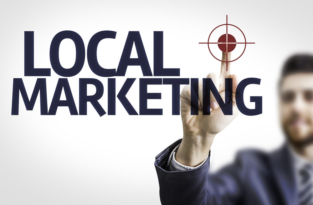 Business,Man,Pointing,To,Transparent,Board,With,Text:,Local,Marketing